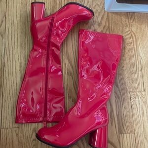 Red GOGO boots from Dolls Kill